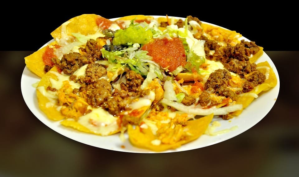 Nachos with mince meat and melted cheese